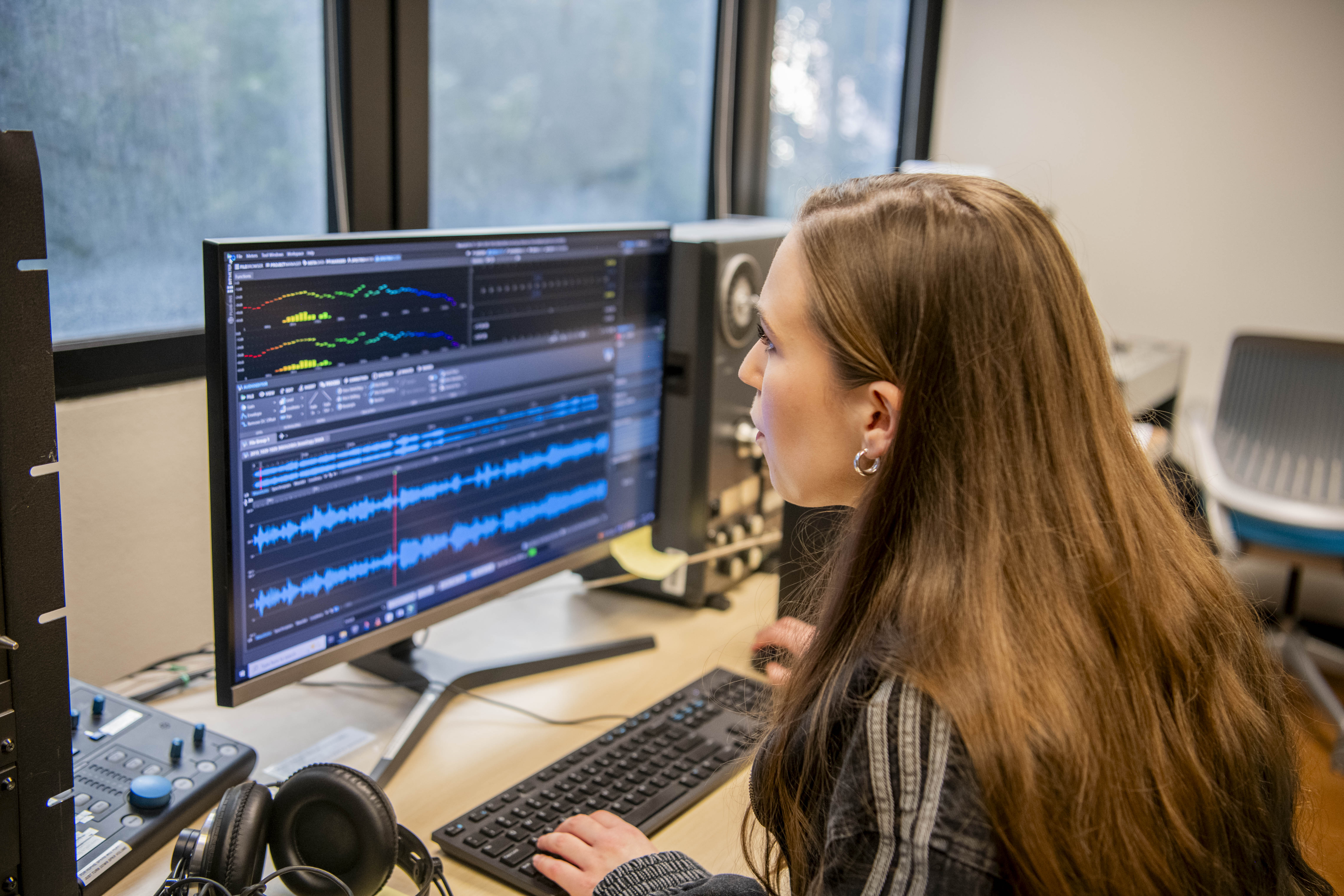 A photograph of Abigail Chapuis working on a computer.